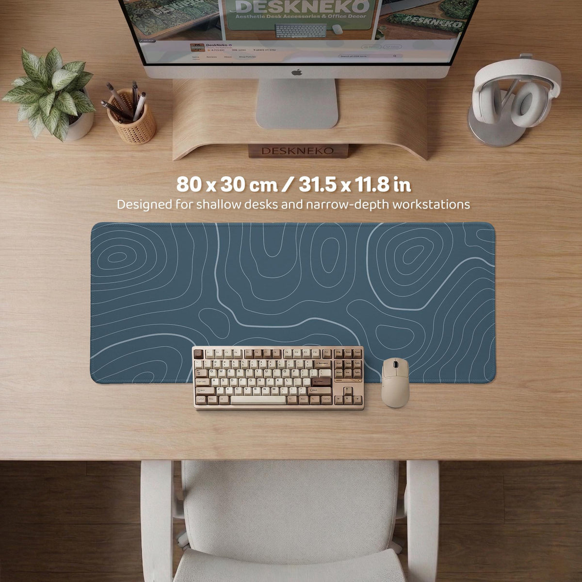 Blue mousepad with a topographic line pattern on a slate background.