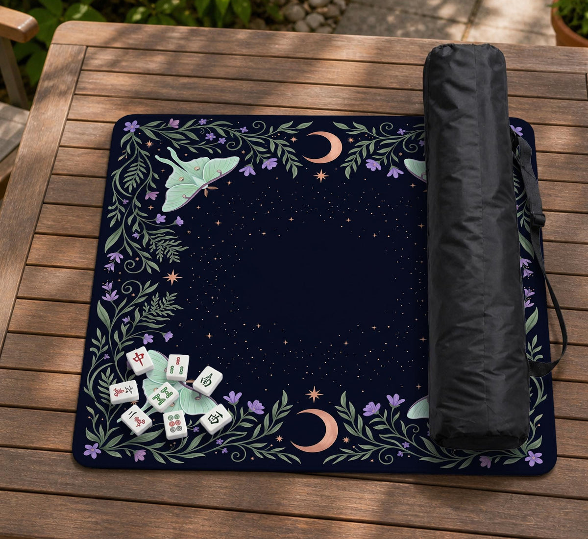 Navy square mahjong mat with a floral border, copper moons, scattered stars, pale moths, and leafy botanical details.