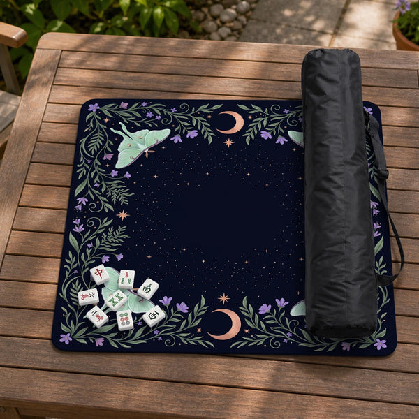 Navy square mahjong mat with a floral border, copper moons, scattered stars, pale moths, and leafy botanical details.