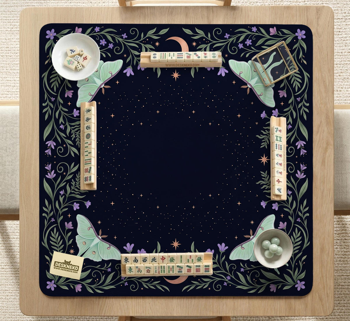 Navy square mahjong mat with a floral border, copper moons, scattered stars, pale moths, and leafy botanical details.