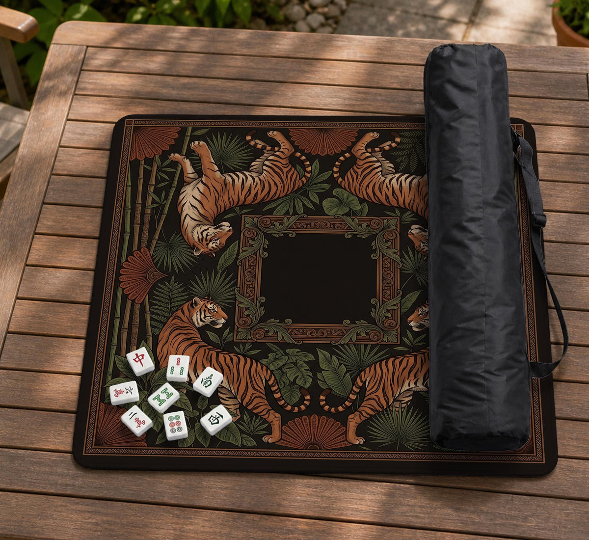 Black square mahjong mat with mirrored tiger faces, bamboo, dark tropical leaves, ornate border details, and orange accents.