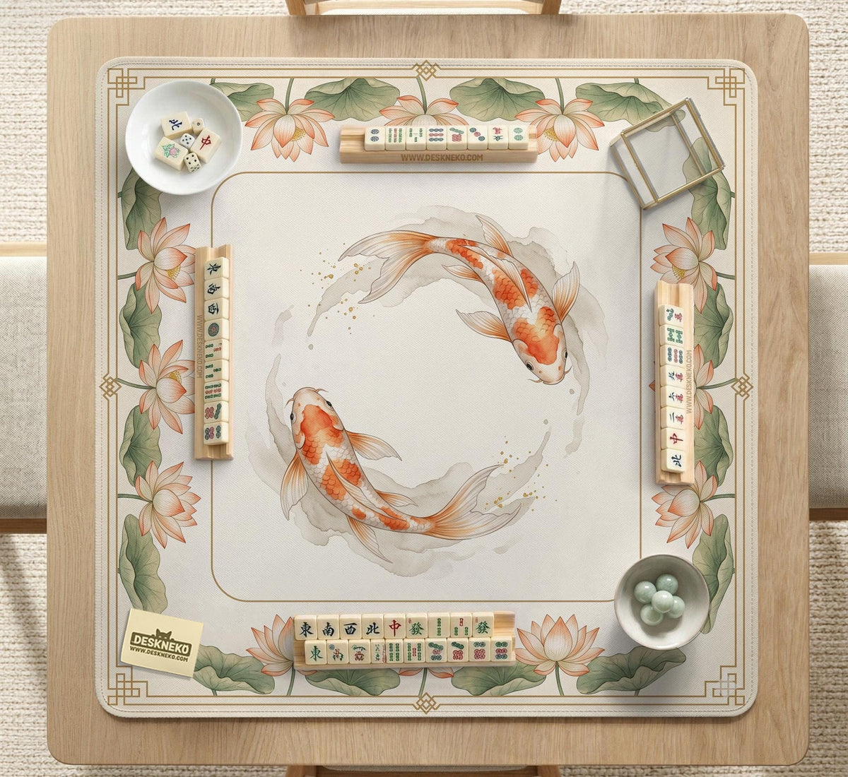 Ivory square mahjong mat with watercolor koi fish, lotus flowers, peach blossoms, sage leaves, and a thin gold border.