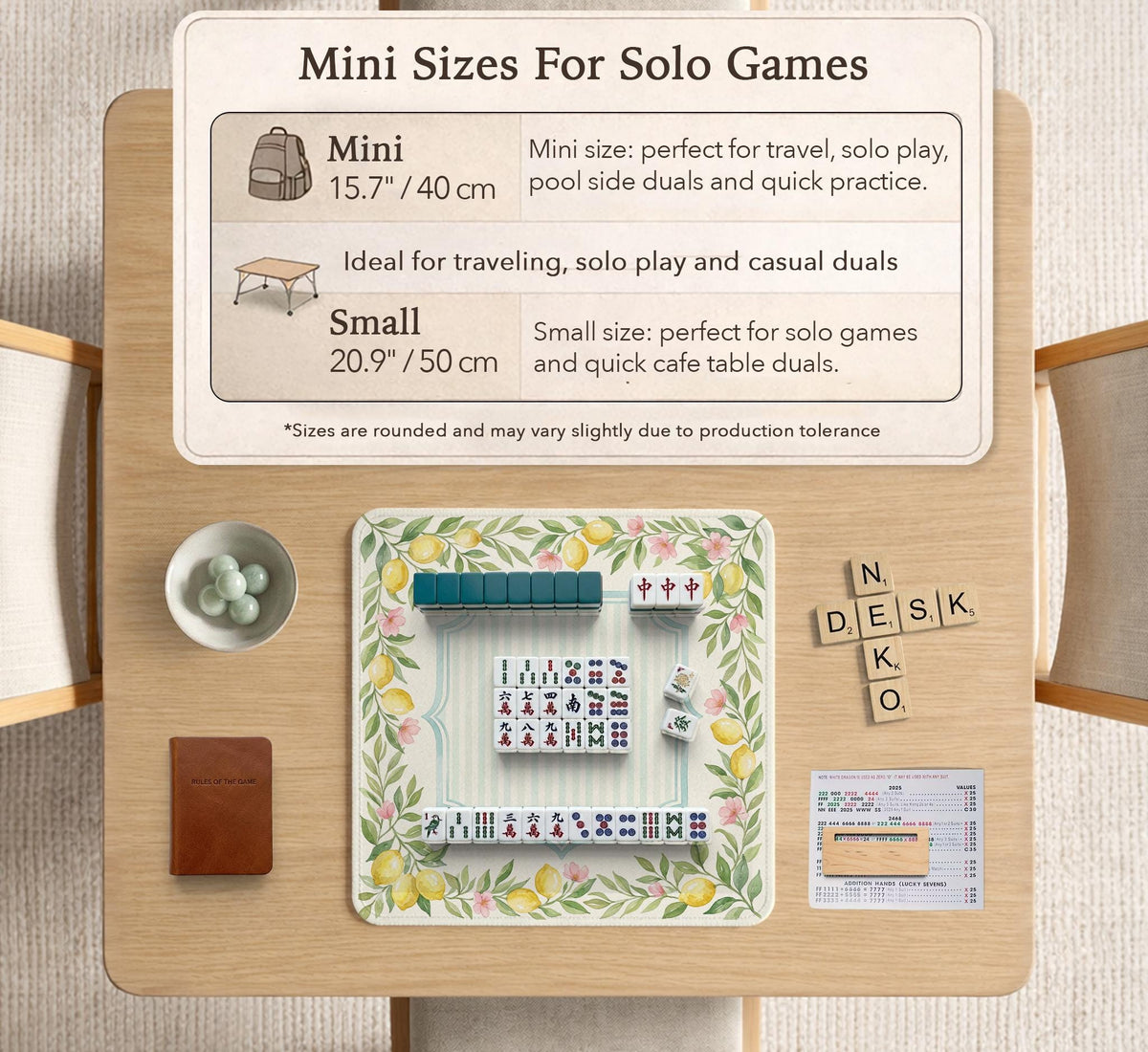 Square yellow mahjong mat with a citrus garden border, green vines, pink blossoms, aqua accents, and a plain center play area.