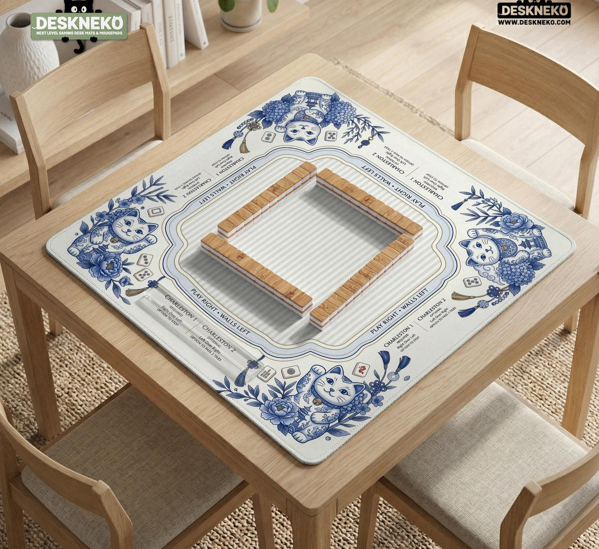 Blue and white square mahjong mat with lucky cat artwork, floral chinoiserie pattern, tile icons, and a rule guide layout.