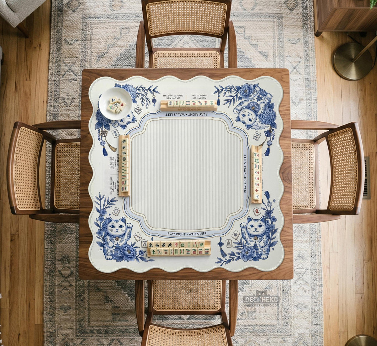 Blue and white square mahjong mat with lucky cat artwork, floral chinoiserie pattern, tile icons, and a rule guide layout.