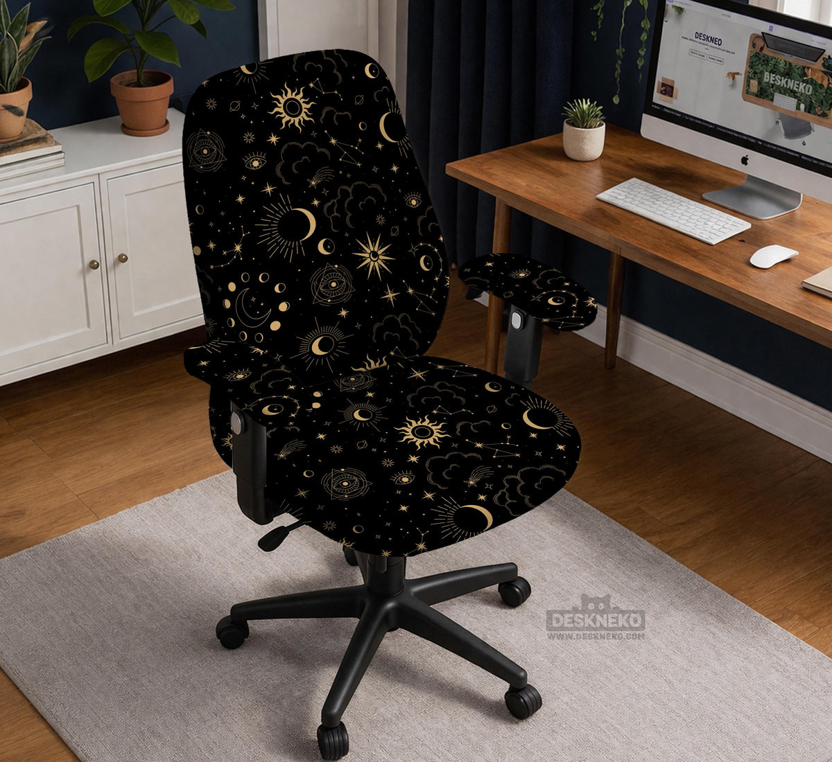Black chair cover with gold moons, suns, stars, constellations, and line art printed across the fabric.