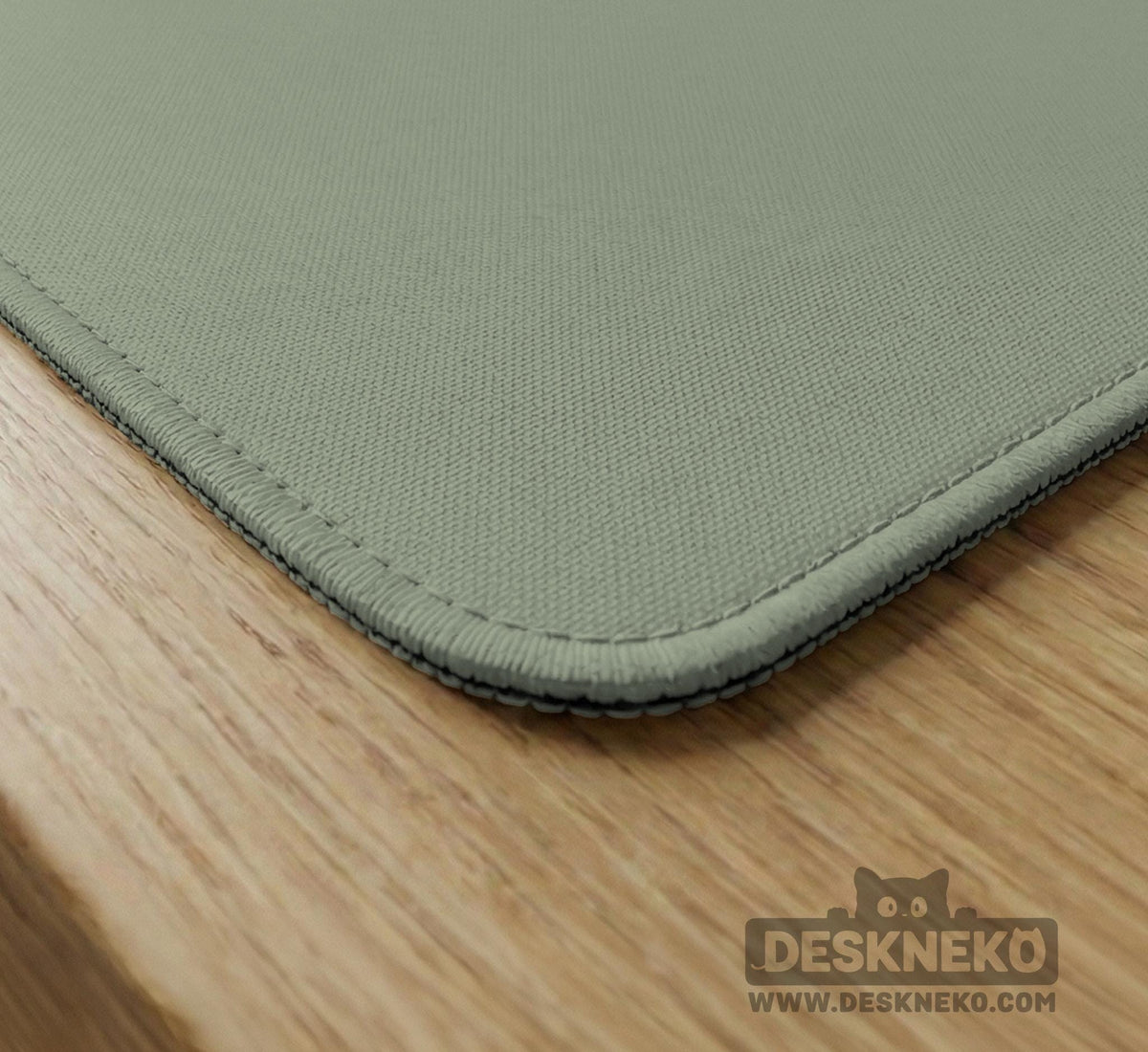 A plain light sage green square mahjong mat with a smooth solid-color surface.