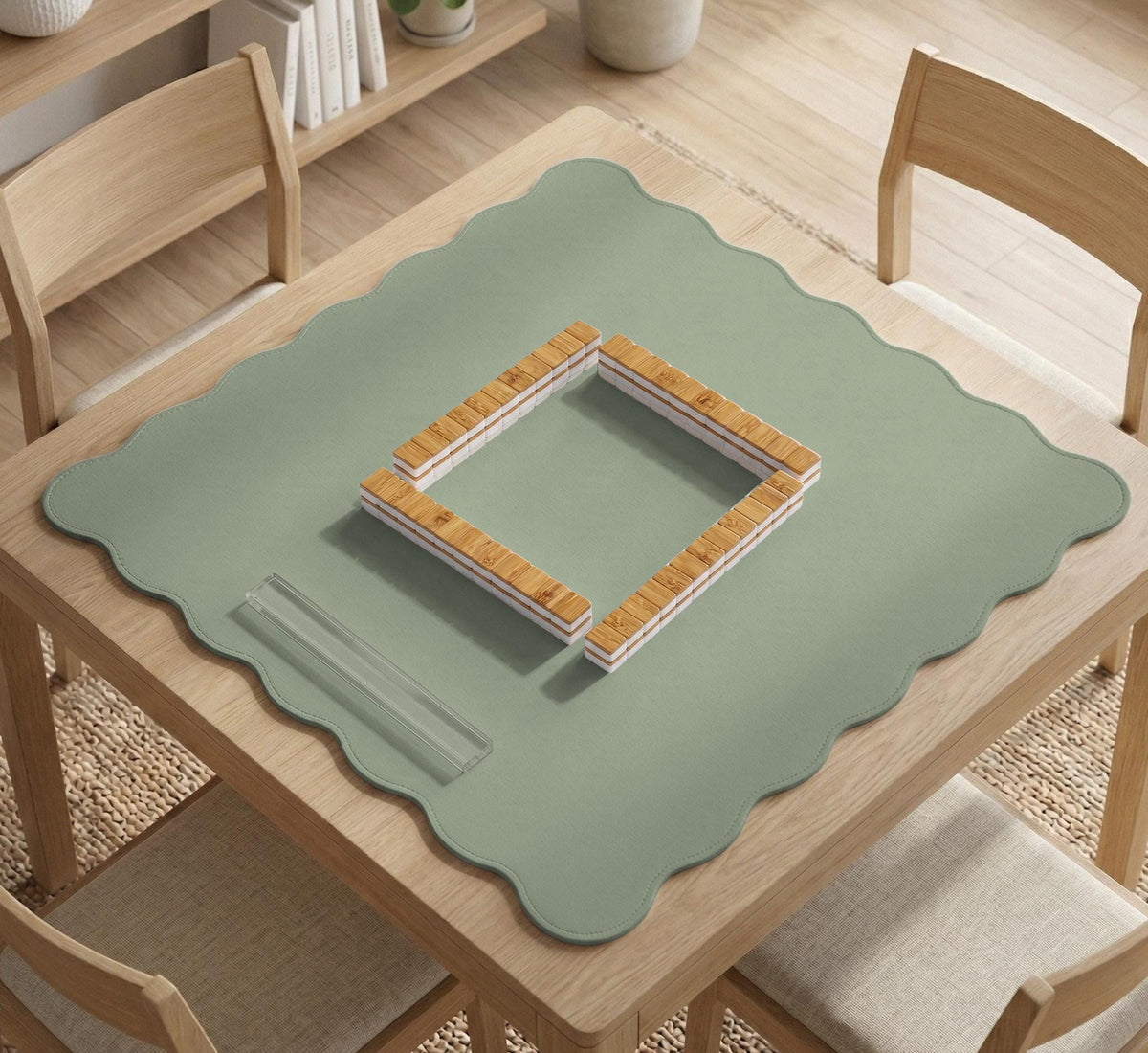 A plain light sage green square mahjong mat with a smooth solid-color surface.