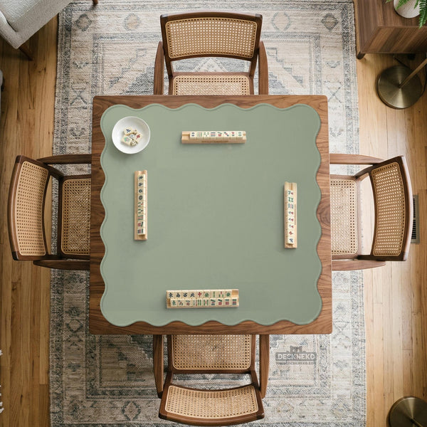 A plain light sage green square mahjong mat with a smooth solid-color surface.