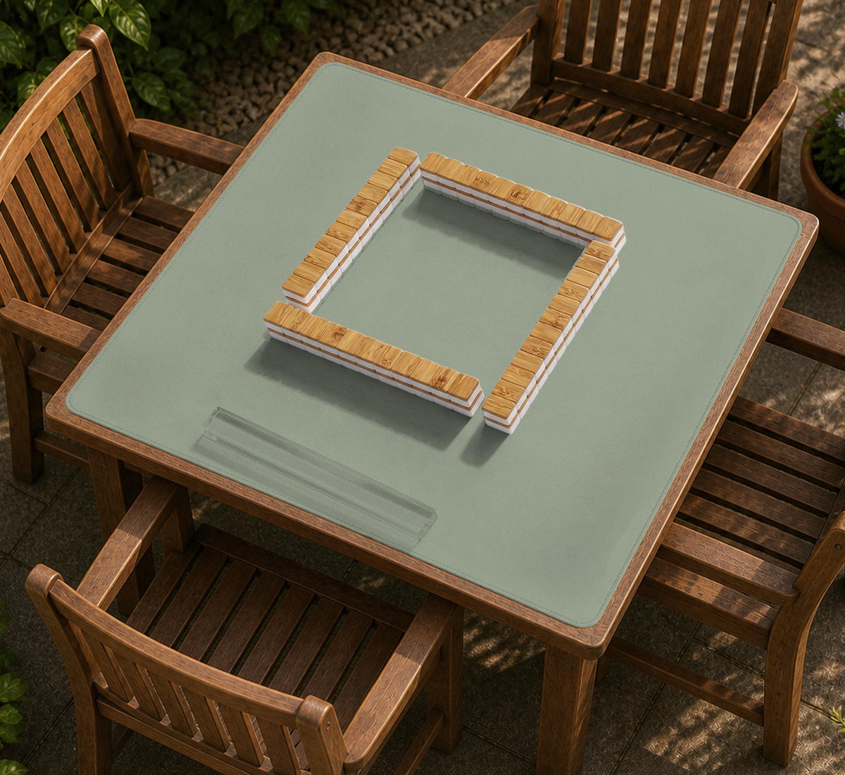 A plain light sage green square mahjong mat with a smooth solid-color surface.