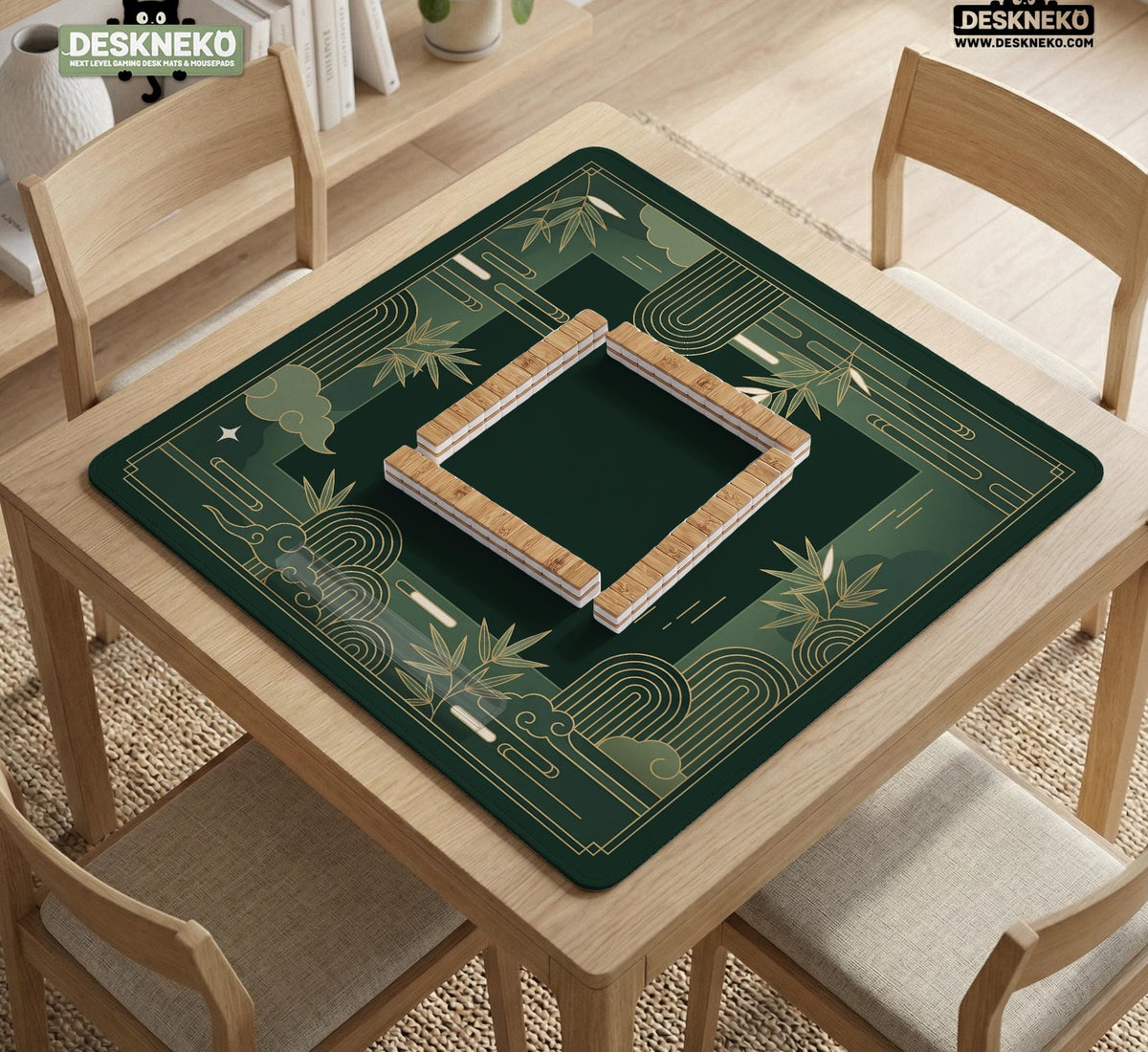 Square emerald green mahjong mat with bamboo line art, gold geometric cloud shapes, and a plain center playing area.