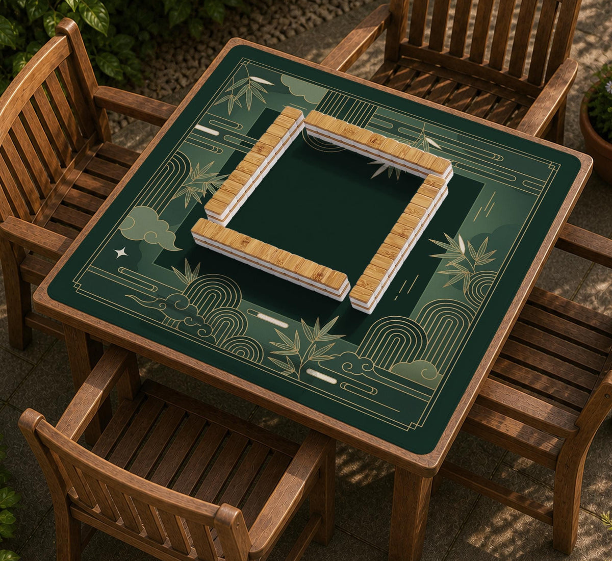Square emerald green mahjong mat with bamboo line art, gold geometric cloud shapes, and a plain center playing area.