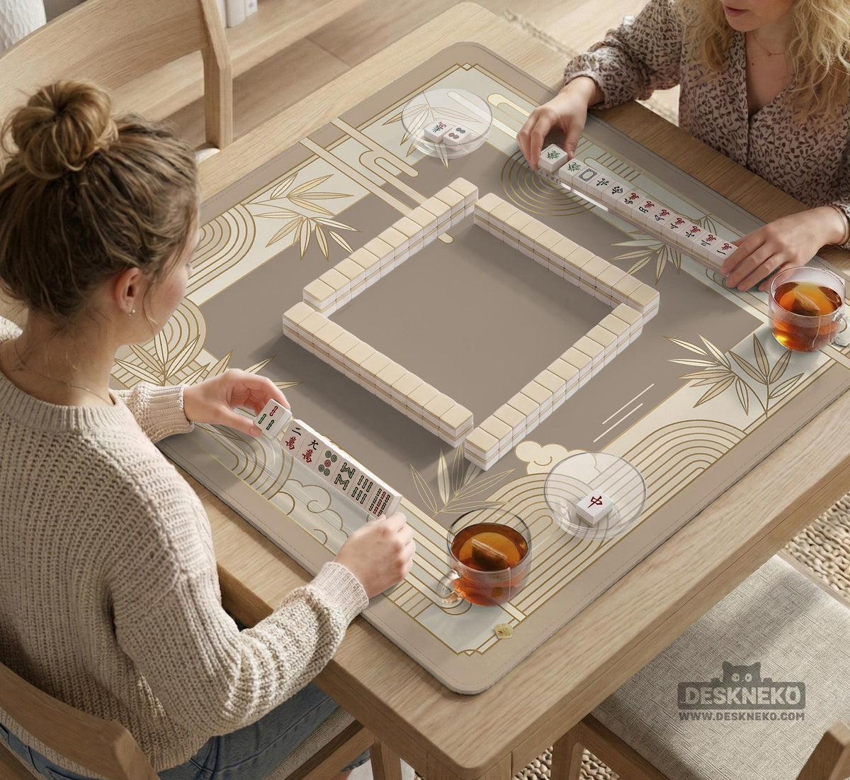 Beige and gold square mahjong mat with a bamboo pattern and geometric border.