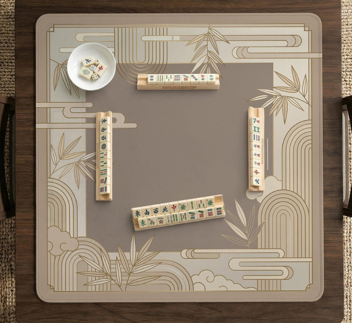 Beige and gold square mahjong mat with a bamboo pattern and geometric border.