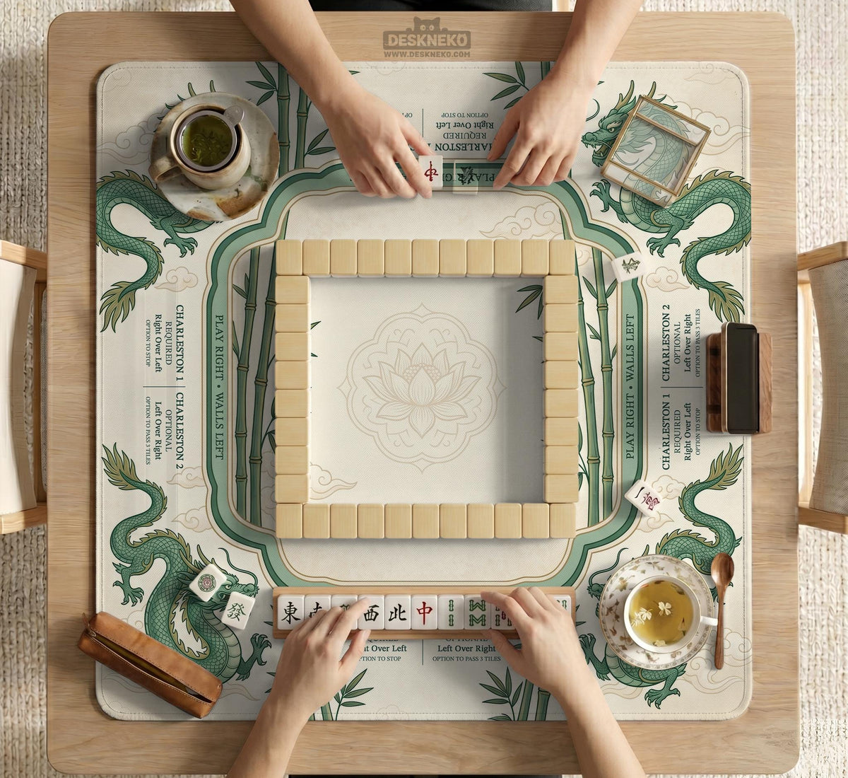Sage green mahjong mat with a bamboo pattern, dragon design, printed rules around the edge, and a scalloped edge option.
