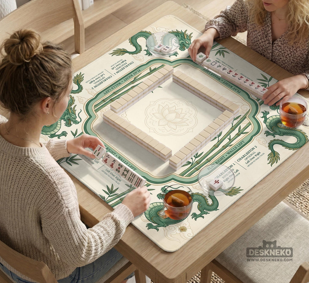 Sage green mahjong mat with a bamboo pattern, dragon design, printed rules around the edge, and a scalloped edge option.