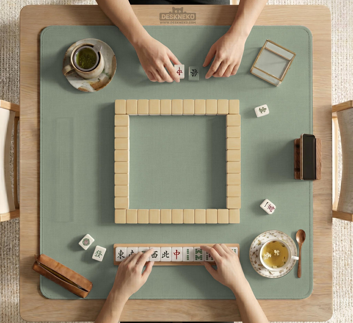 A square sage green mahjong mat with scalloped edges on a plain background.