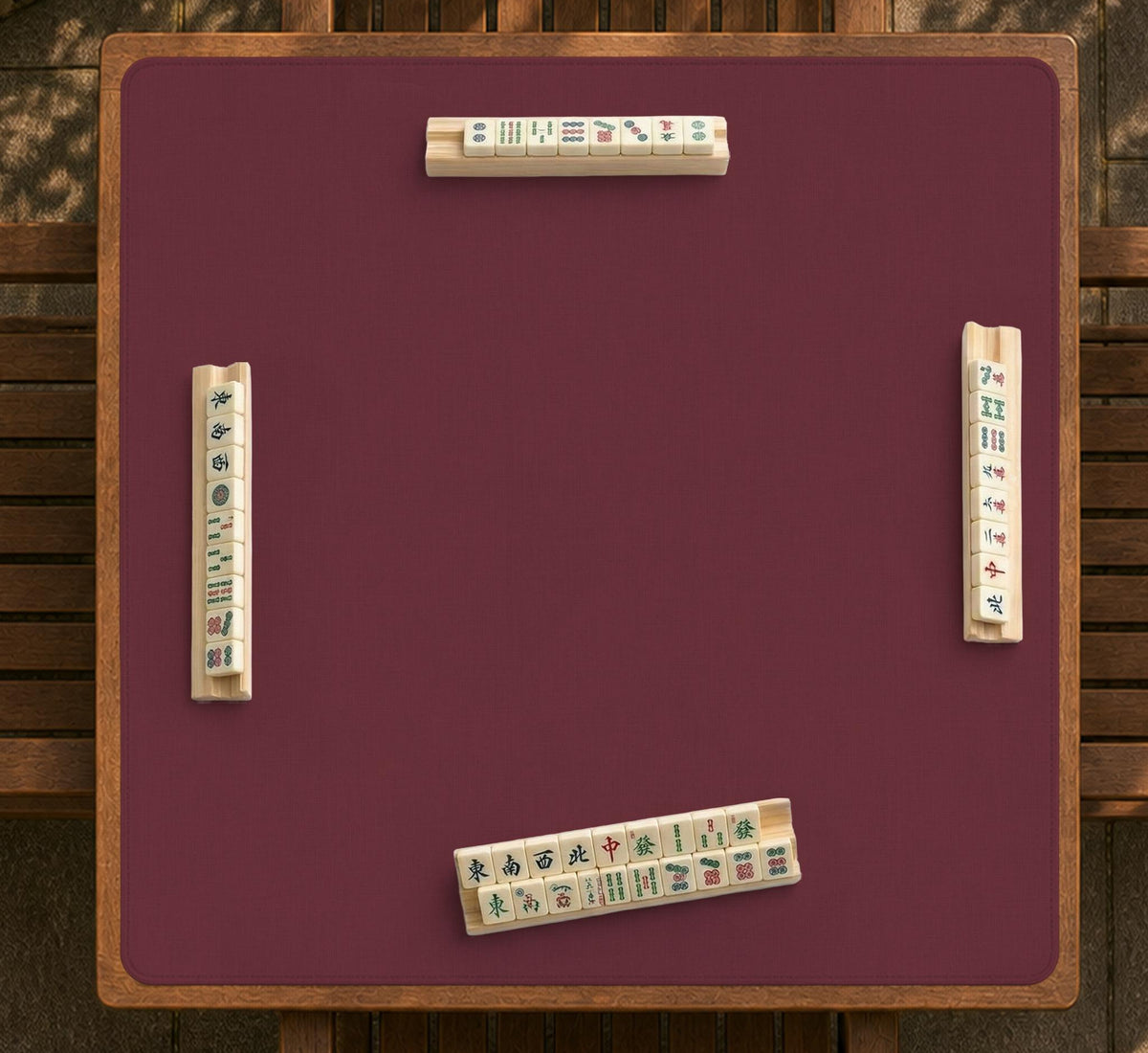 Plain burgundy square mahjong mat with scalloped edges on a white background.