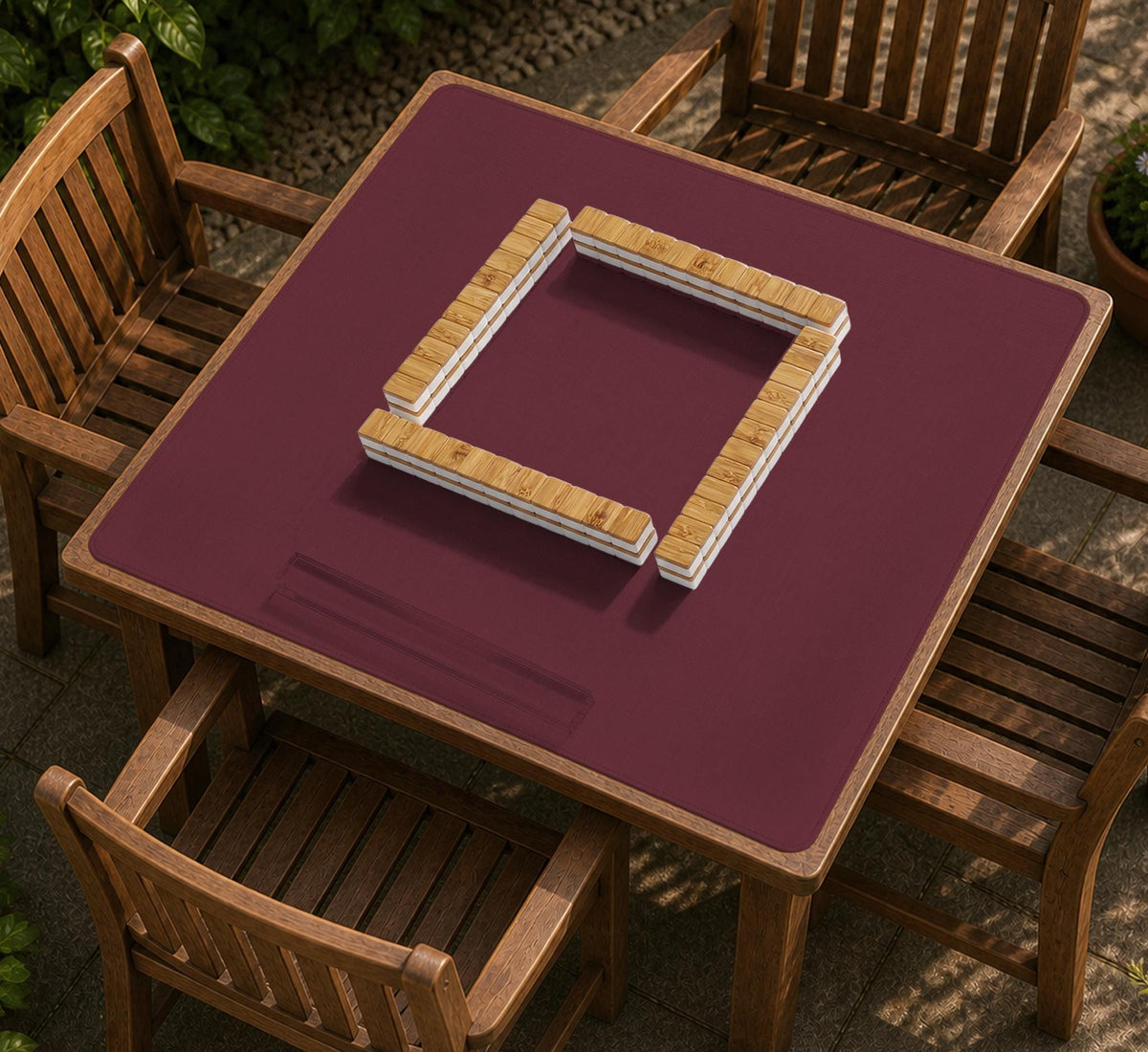 Plain burgundy square mahjong mat with scalloped edges on a white background.