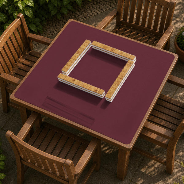 Plain burgundy square mahjong mat with scalloped edges on a white background.