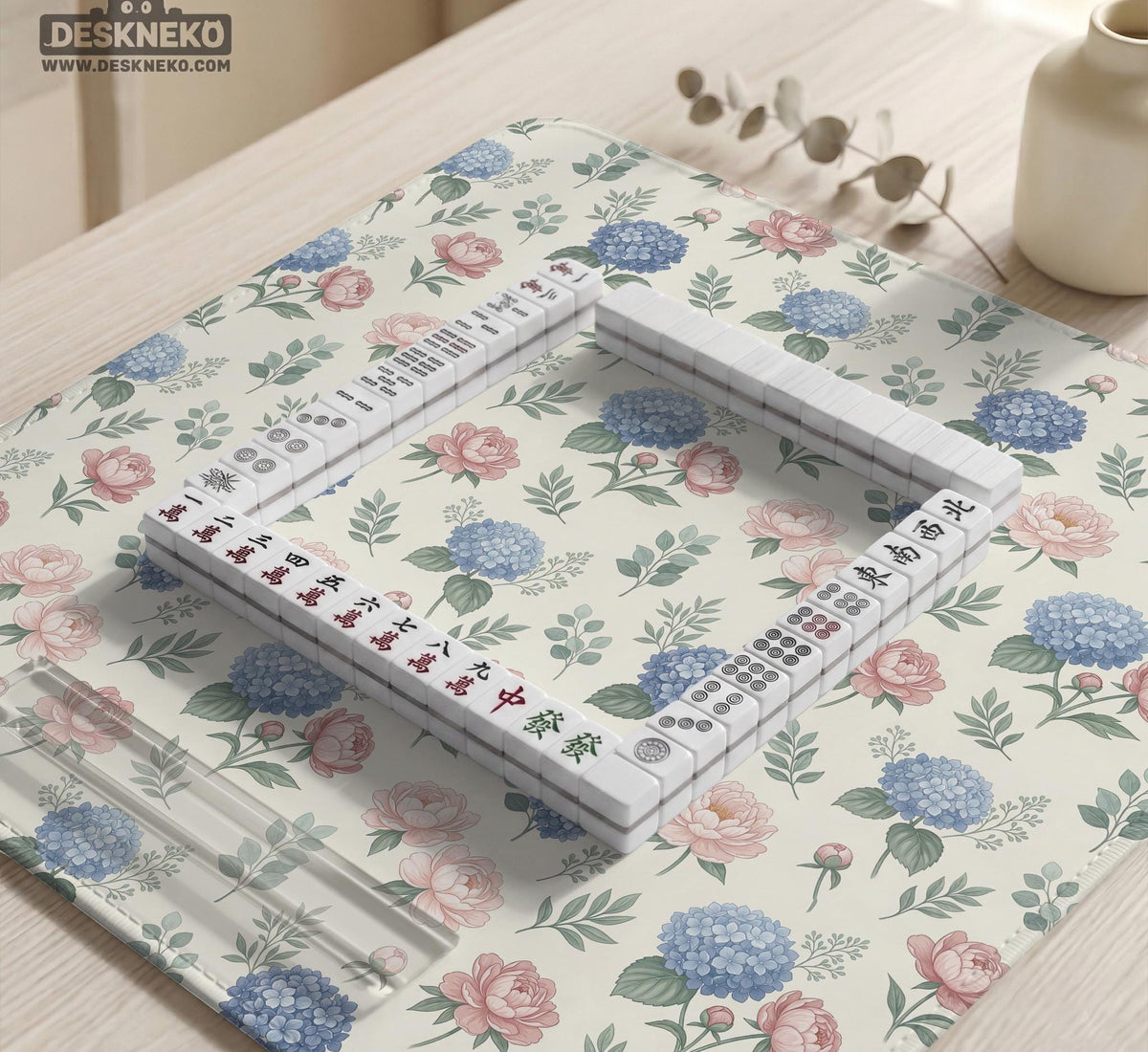 Pink floral mahjong table mat with peonies, blue hydrangeas, sage green leaves, and an ivory background.