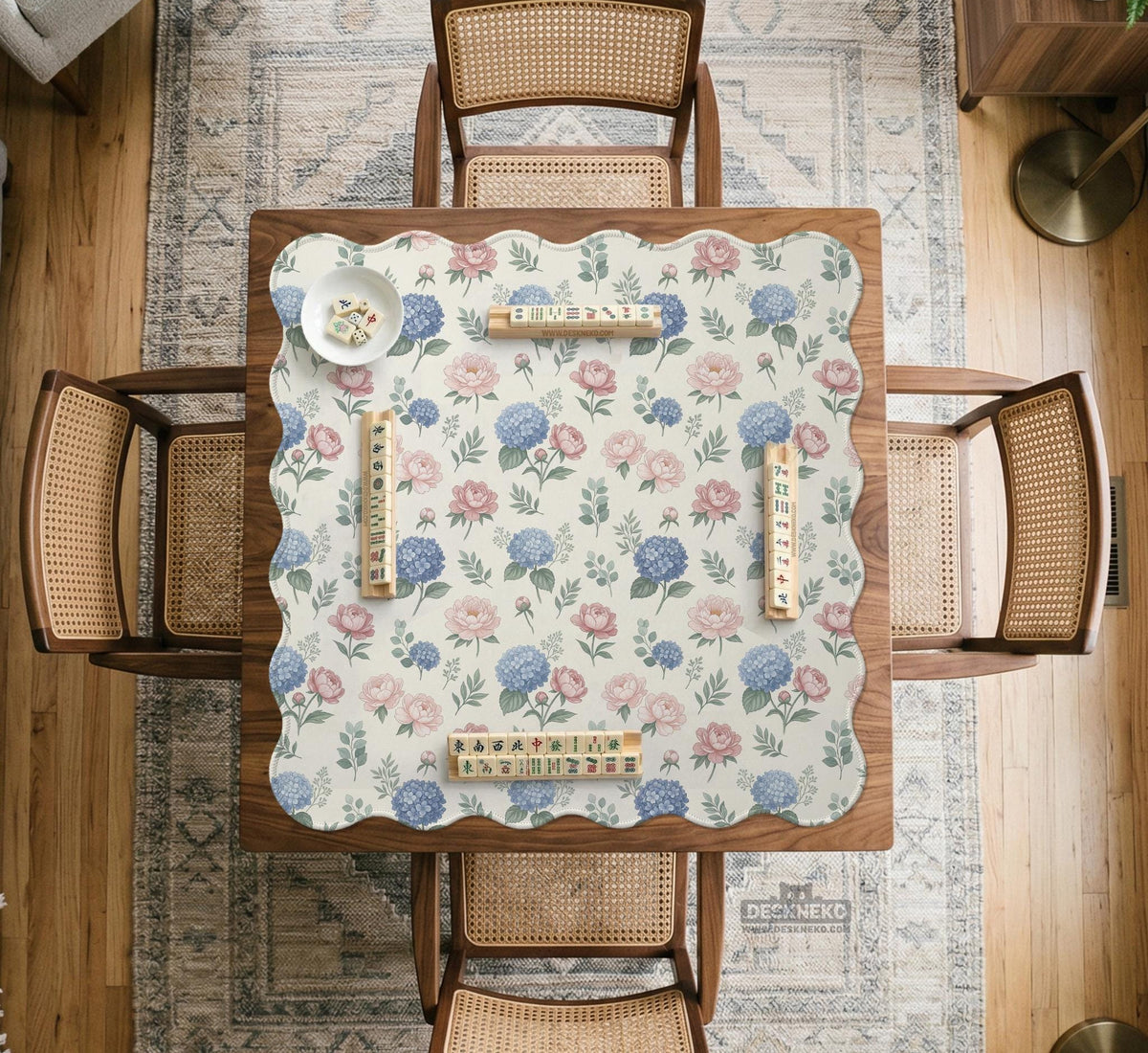 Pink floral mahjong table mat with peonies, blue hydrangeas, sage green leaves, and an ivory background.