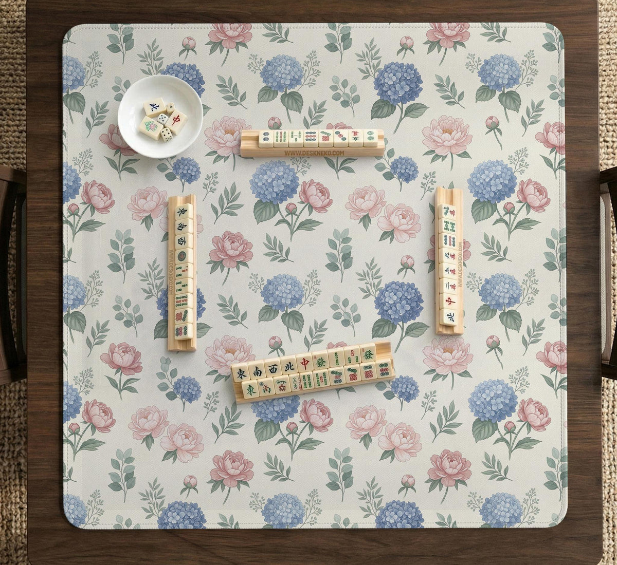 Pink floral mahjong table mat with peonies, blue hydrangeas, sage green leaves, and an ivory background.