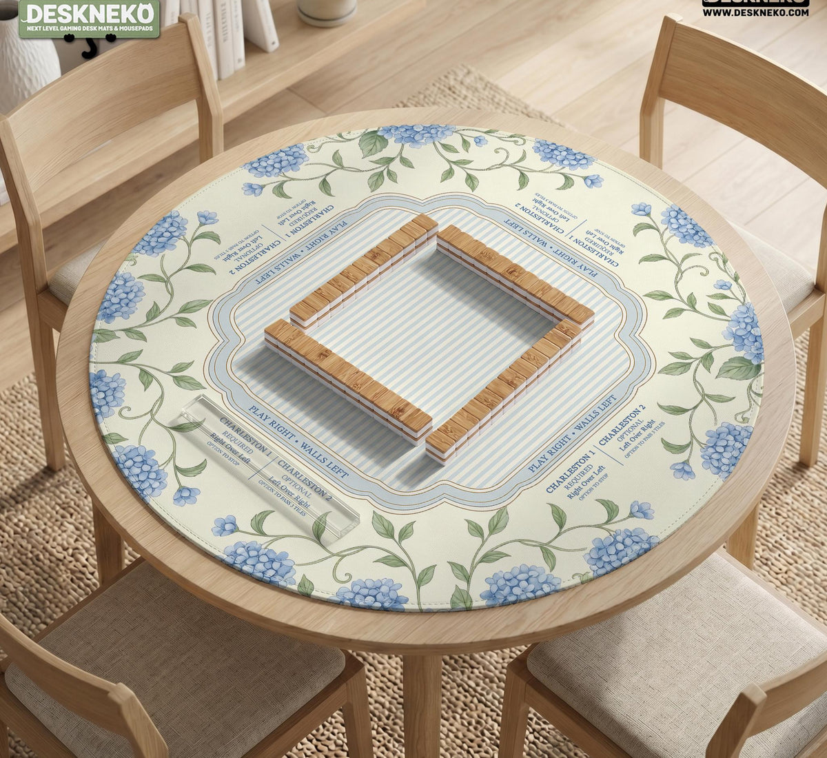 A square mahjong mat with blue hydrangea flowers, green vines, a cream background, a striped center, and printed rules around the border.