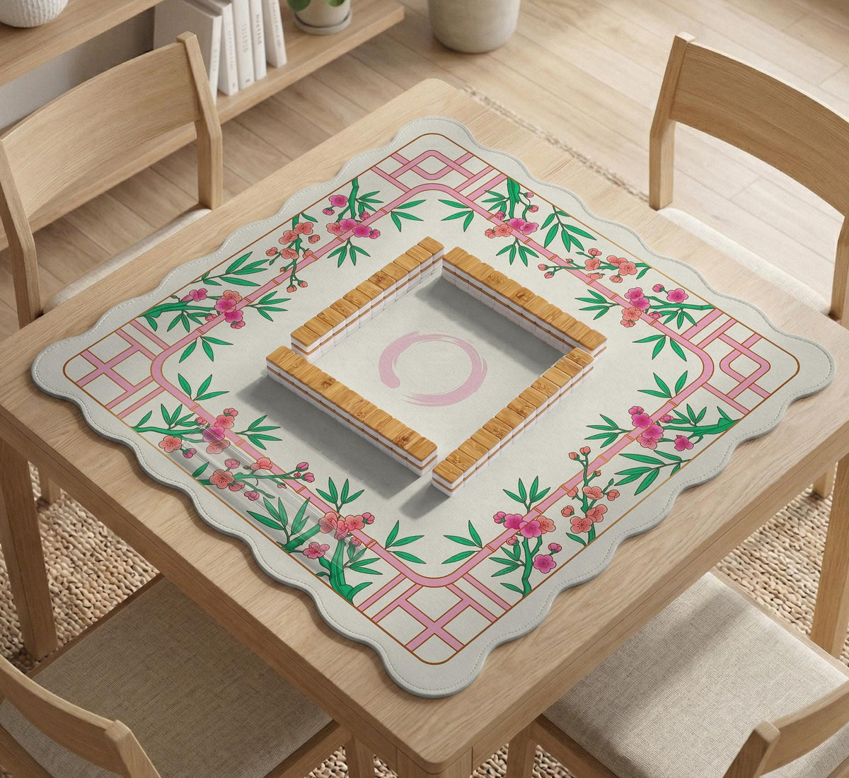 Pink cherry blossom floral mahjong table mat with a cream center and bamboo-style border design.