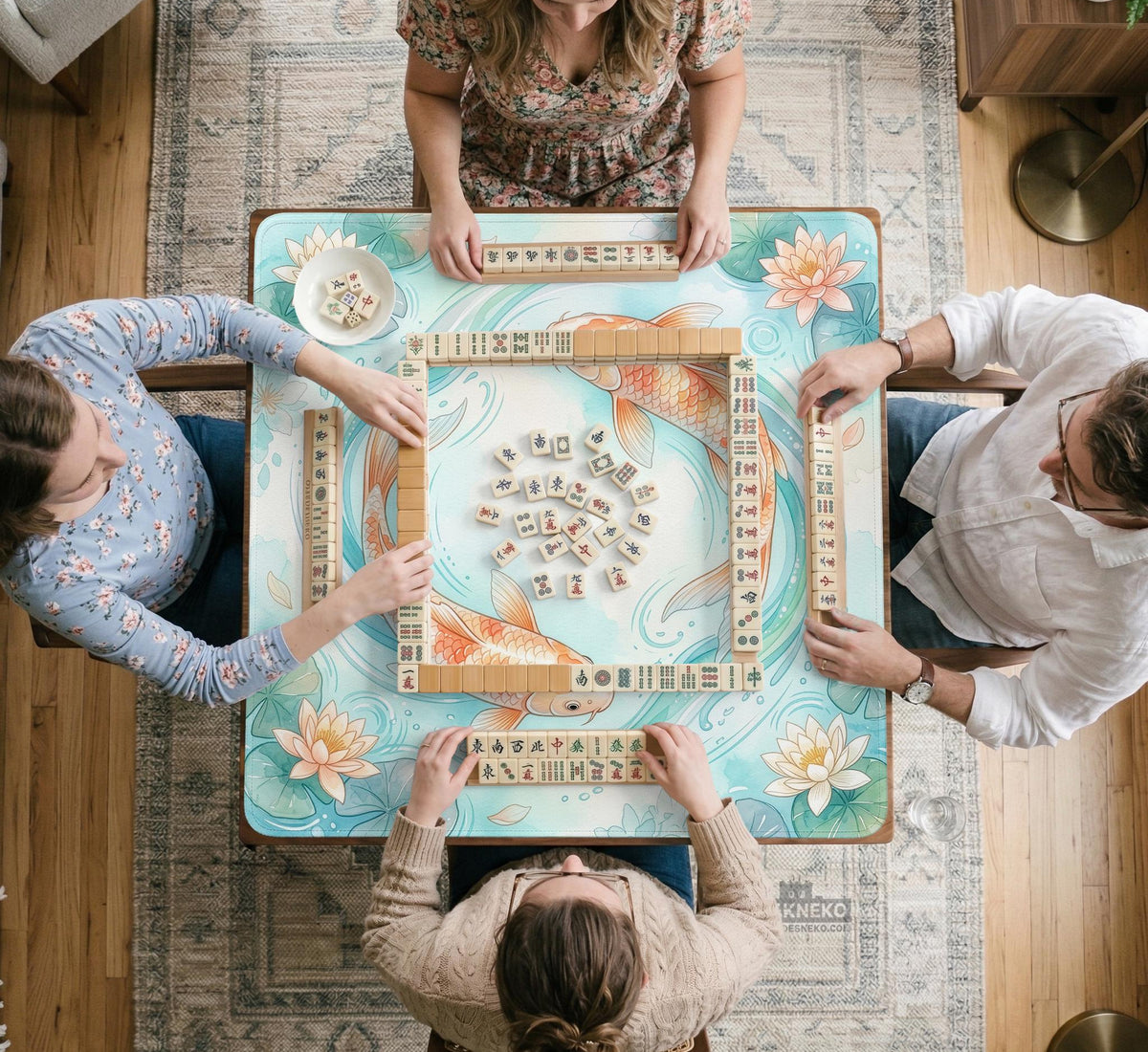Pastel aqua square mahjong mat with orange koi fish, lotus flowers, lily pads, and flowing water lines.