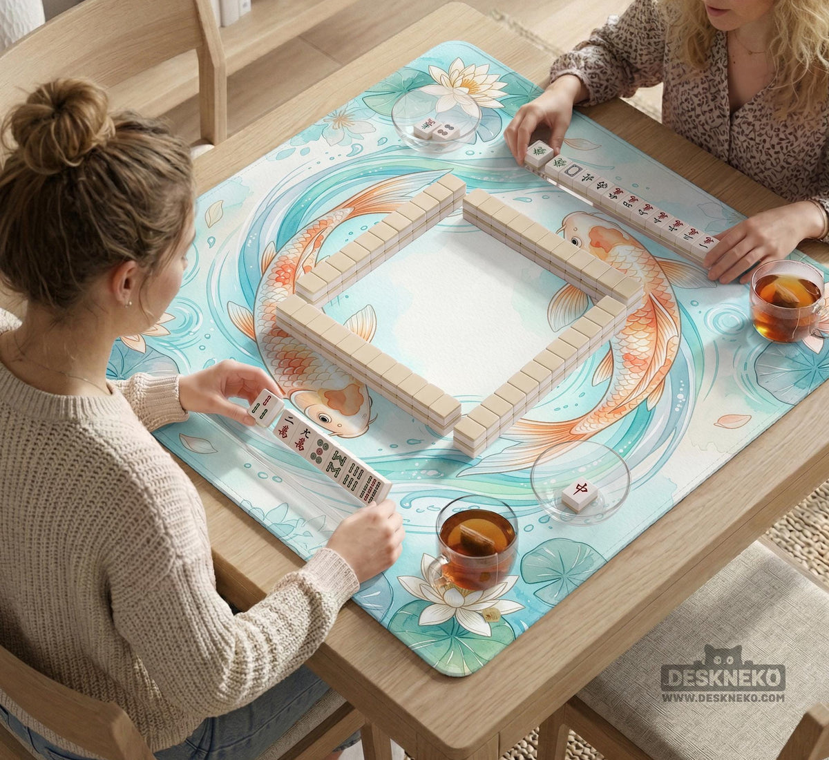 Pastel aqua square mahjong mat with orange koi fish, lotus flowers, lily pads, and flowing water lines.