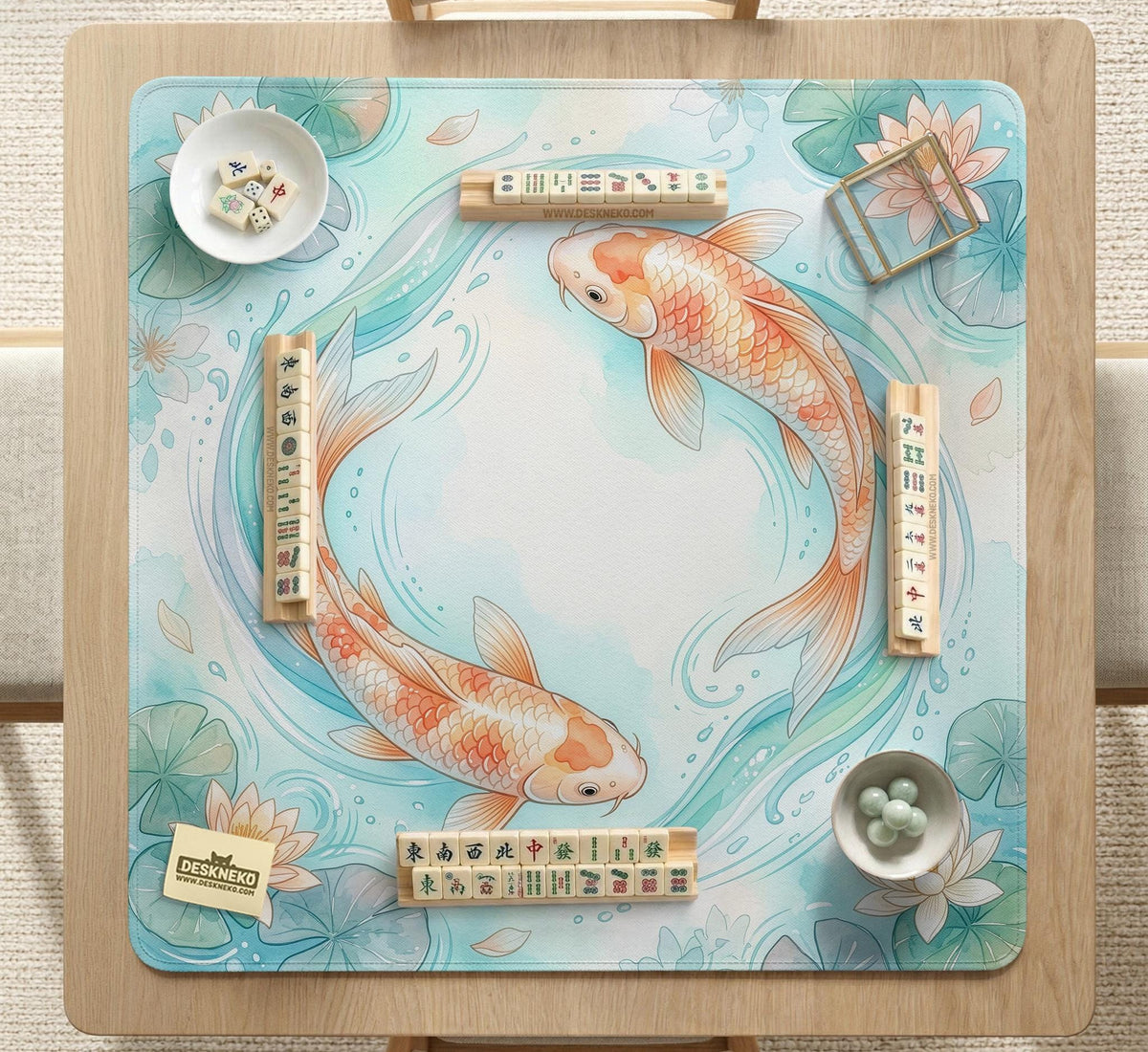 Pastel aqua square mahjong mat with orange koi fish, lotus flowers, lily pads, and flowing water lines.