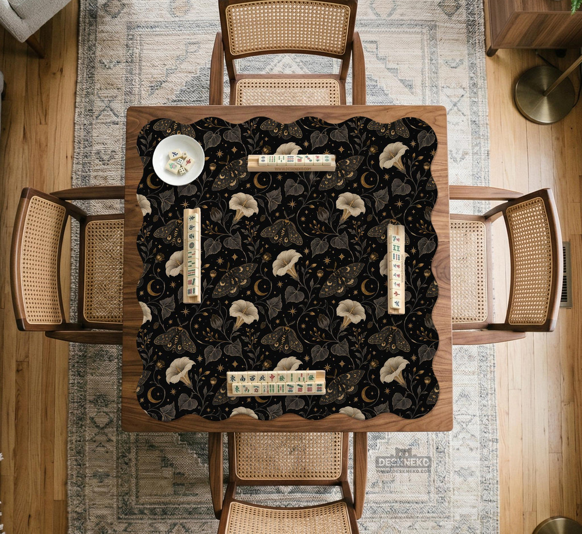 Black square mahjong mat with moths, moonflowers, crescent moons, and scattered stars in a celestial floral pattern.