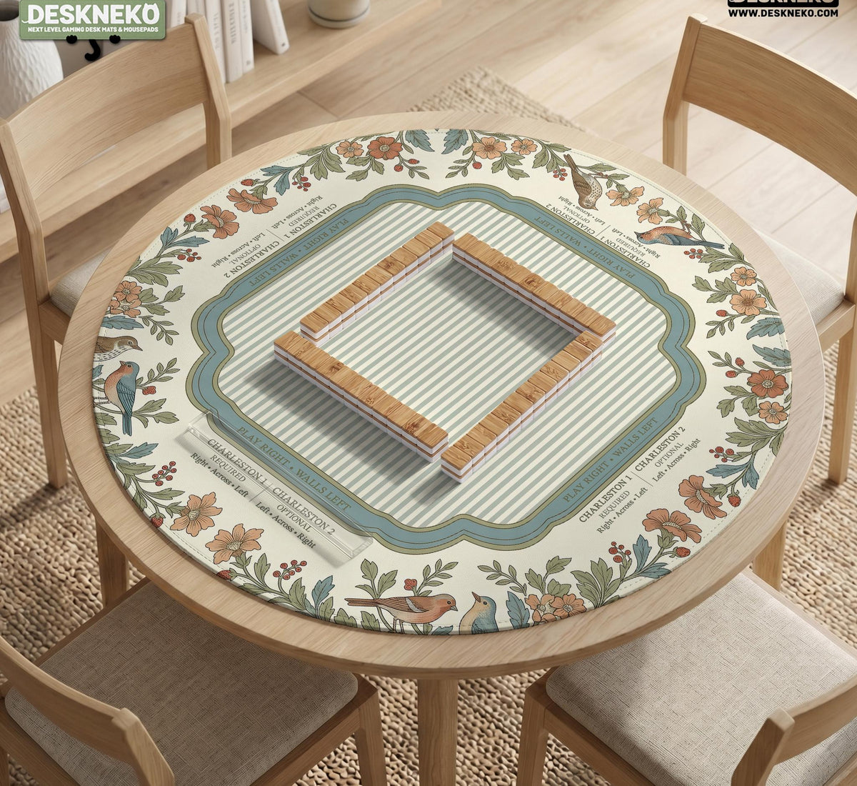 Square mahjong mat with a cream background, blue birds, sage leaves, terracotta flowers, and a decorative botanical border with printed rules text.