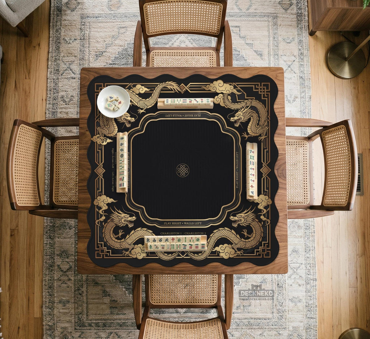 Black mahjong mat with gold dragon artwork, a scalloped edge, and printed Mahjong rules on the surface.