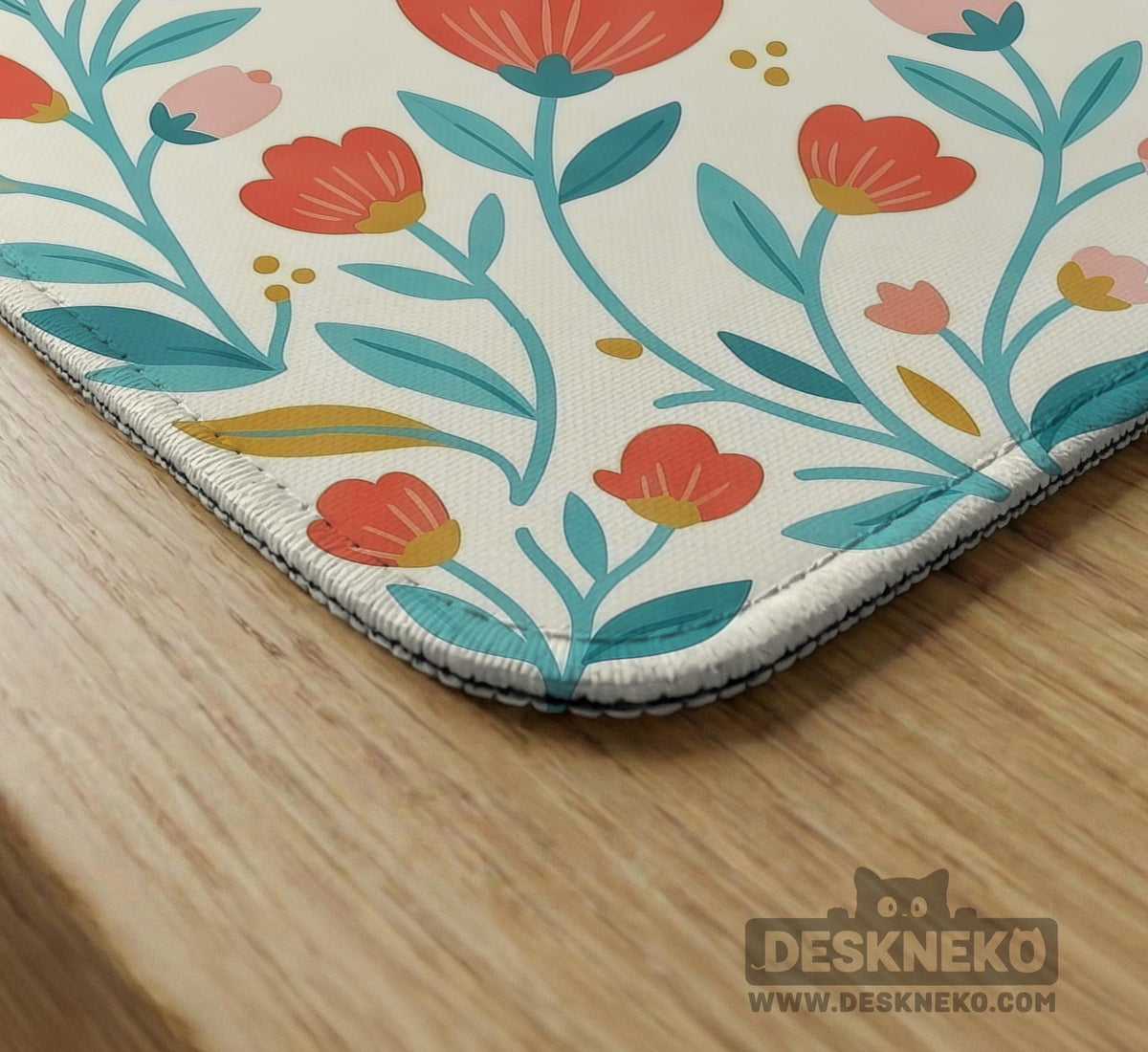 Cream mahjong mat with a coral and teal floral border, rule layout text, Charleston guide notes, and a blank center area for tile play.