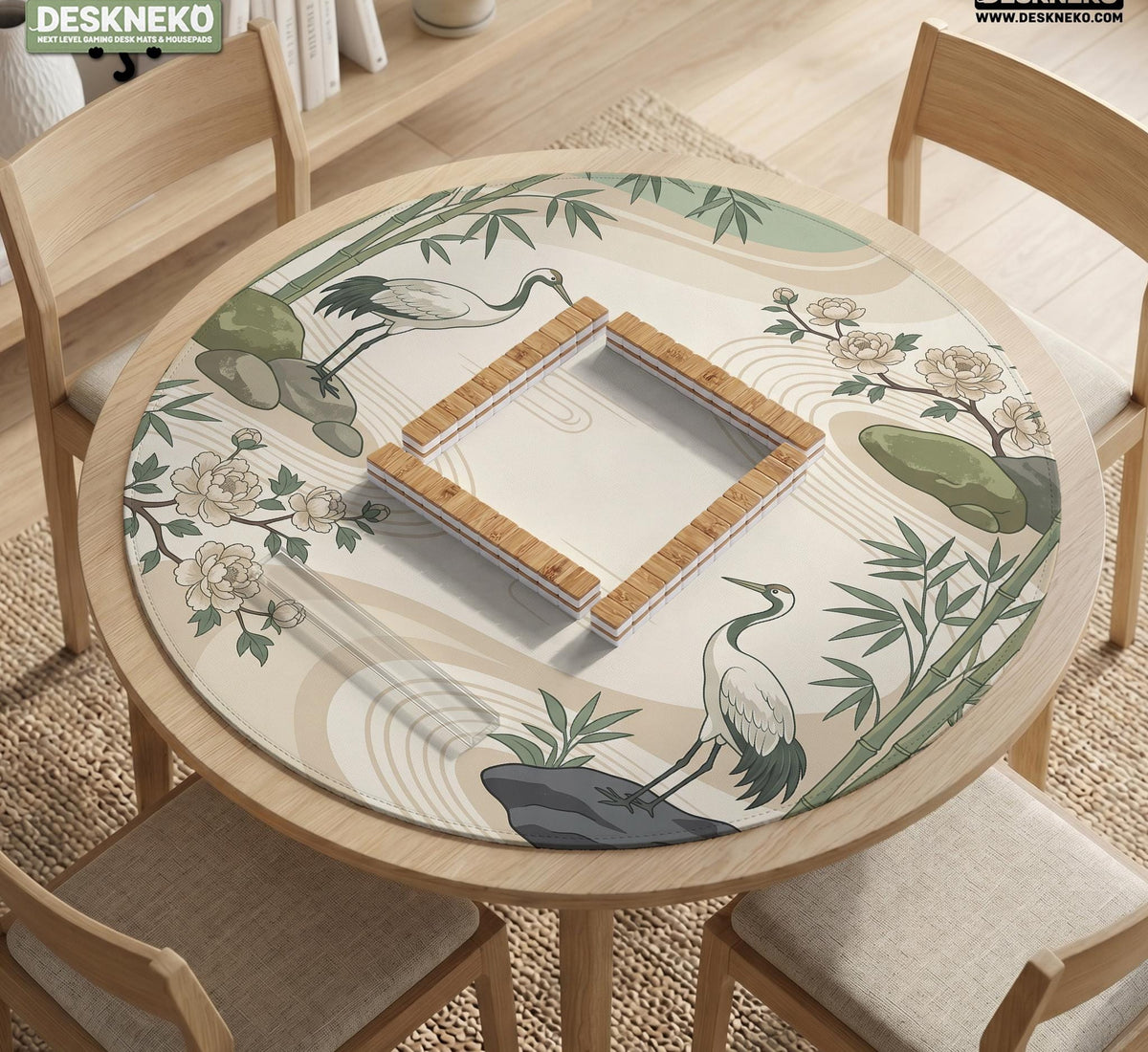 Square mahjong mat with a cream background, sage green cranes, bamboo leaves, peony branches, stones, and thin linework.
