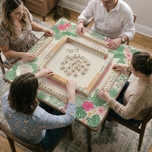 Coral tropical floral mahjong mat with hibiscus flowers, palm leaves, cream sections, and a scalloped edge.