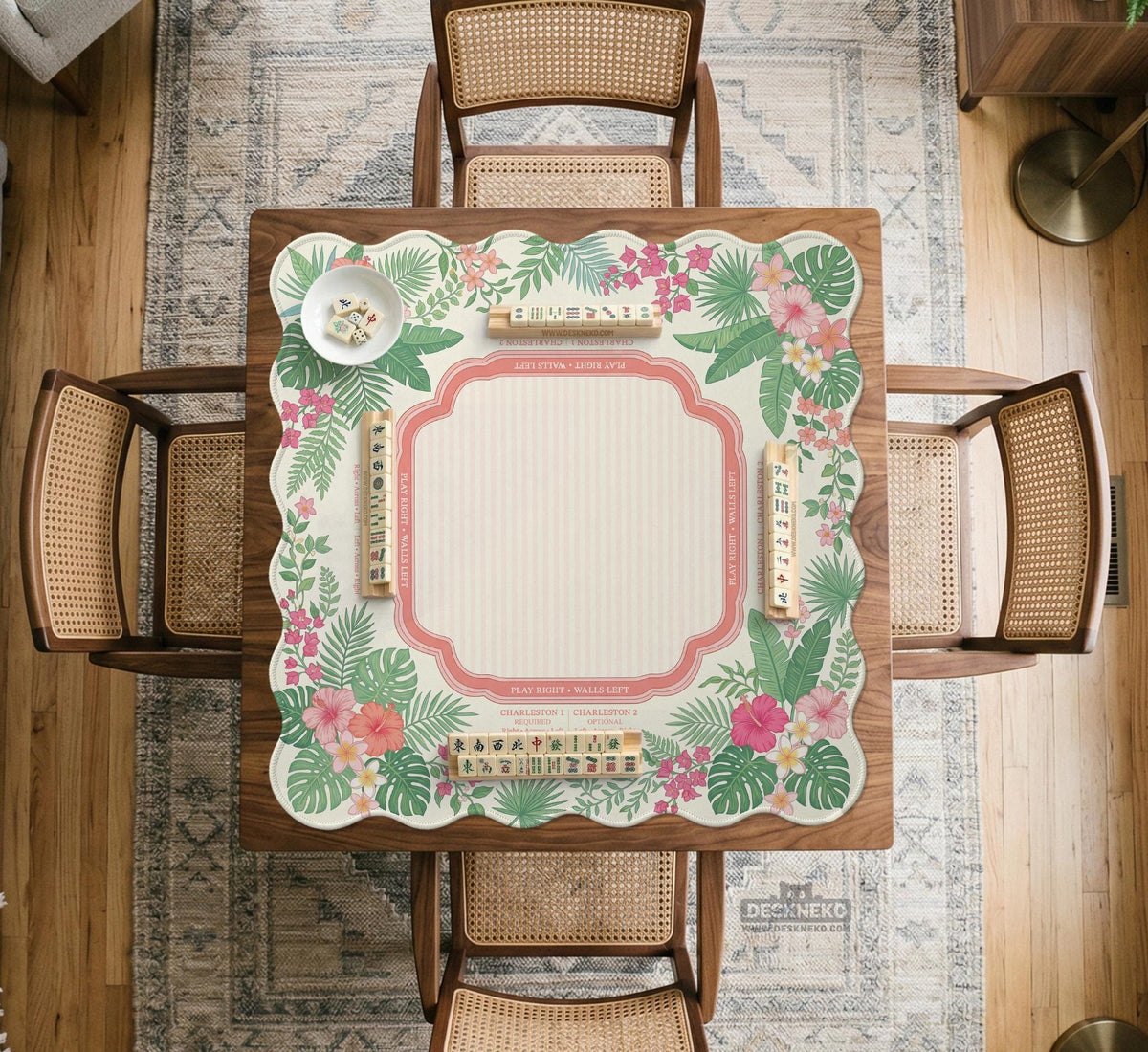 Coral tropical floral mahjong mat with hibiscus flowers, palm leaves, cream sections, and a scalloped edge.