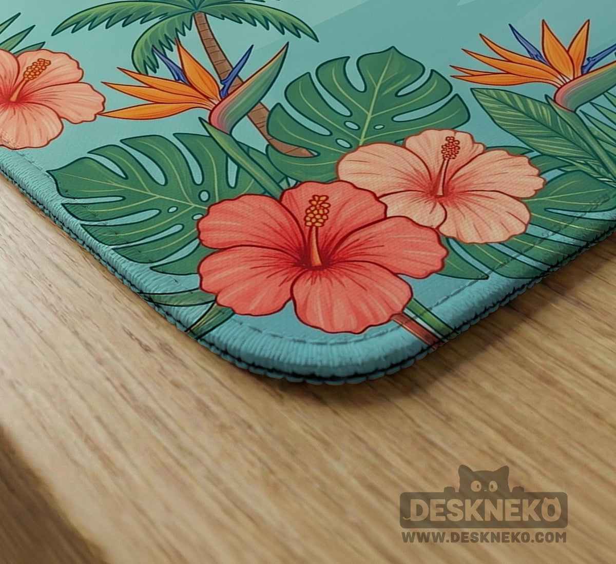 Pink mahjong mat with flamingos, palm leaves, hibiscus flowers, and aqua tropical background.