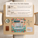 A square mahjong mat with flamingos, hibiscus flowers, palm leaves, and aqua water accents on a coral background with a scalloped edge.