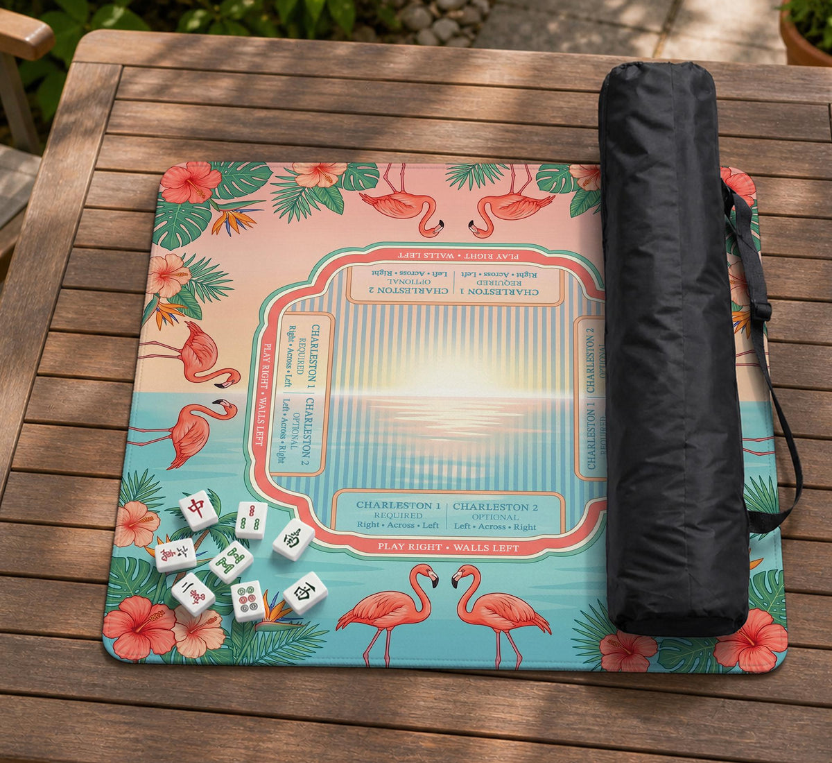 Pink mahjong mat with flamingos, palm leaves, hibiscus flowers, and aqua tropical background.