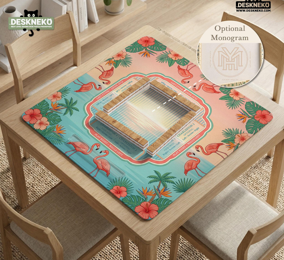 A square mahjong mat with flamingos, hibiscus flowers, palm leaves, and aqua water accents on a coral background with a scalloped edge.