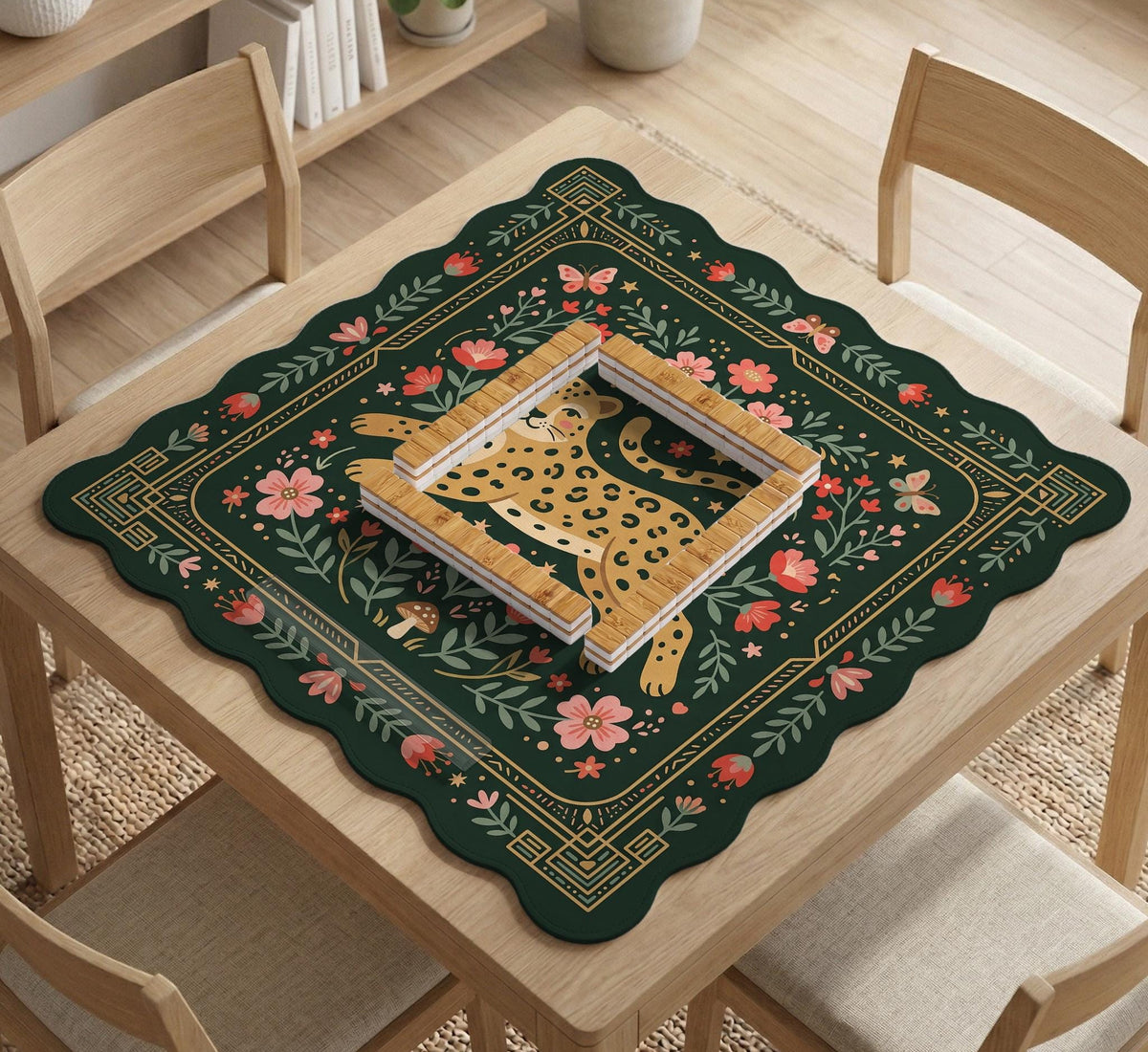 Dark green square mahjong mat with a golden spotted leopard in the center, surrounded by flowers, leafy stems, butterflies, and small star accents.
