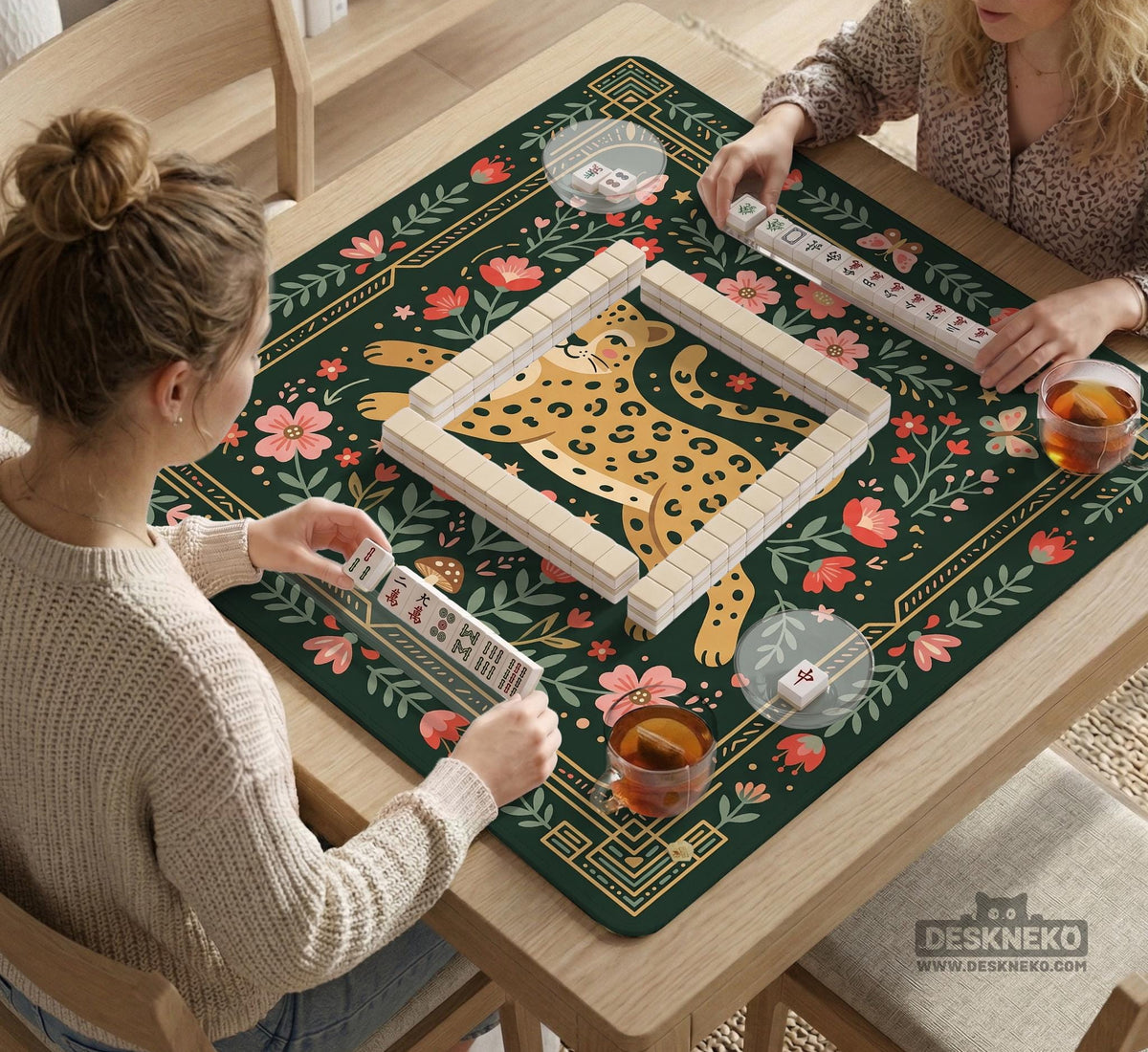 Dark green square mahjong mat with a golden spotted leopard in the center, surrounded by flowers, leafy stems, butterflies, and small star accents.