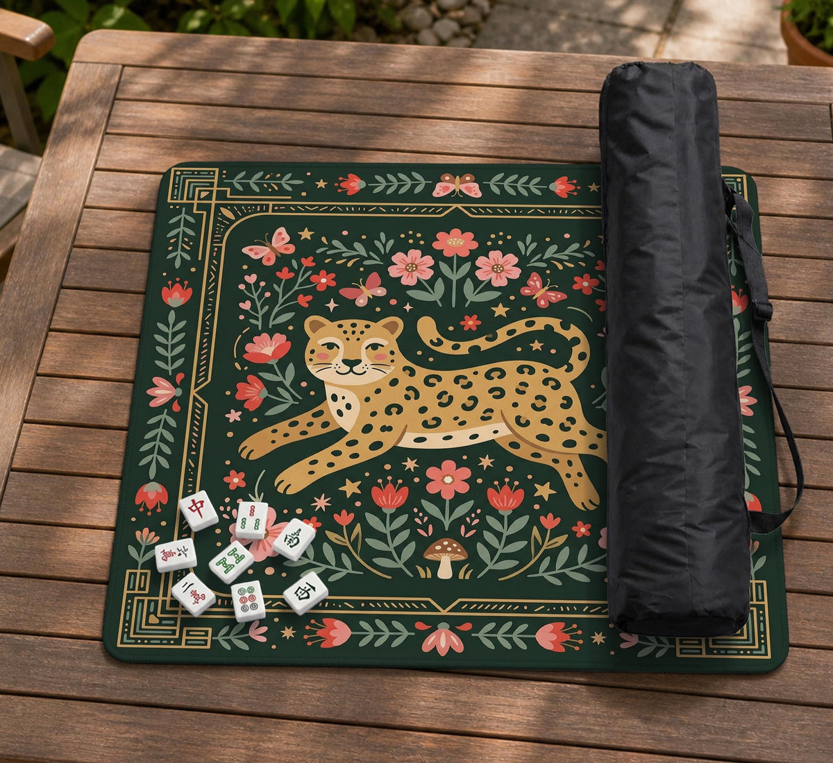 Dark green square mahjong mat with a golden spotted leopard in the center, surrounded by flowers, leafy stems, butterflies, and small star accents.