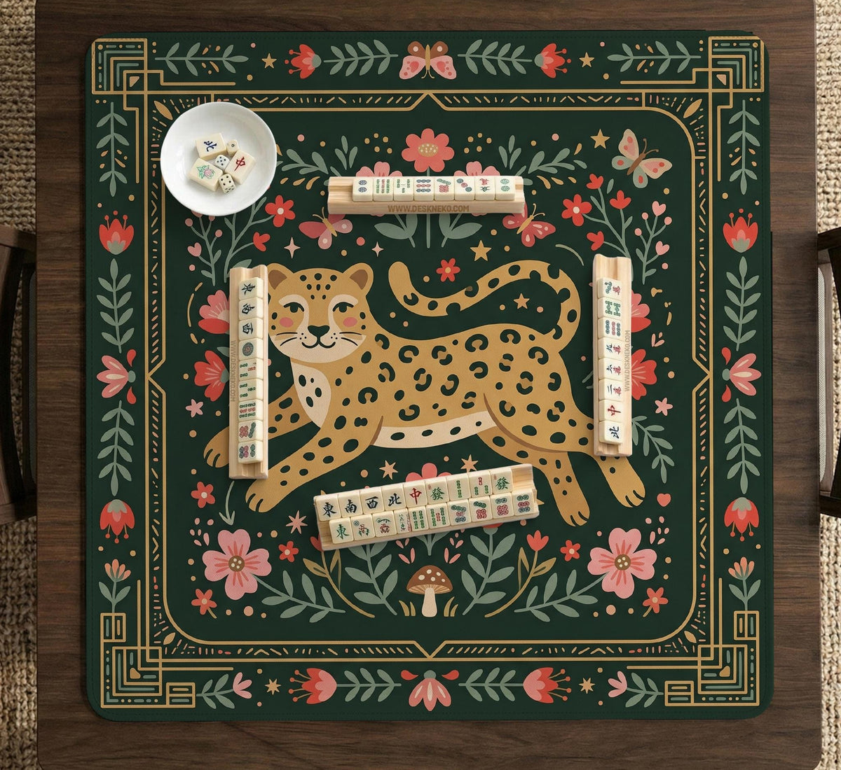 Dark green square mahjong mat with a golden spotted leopard in the center, surrounded by flowers, leafy stems, butterflies, and small star accents.