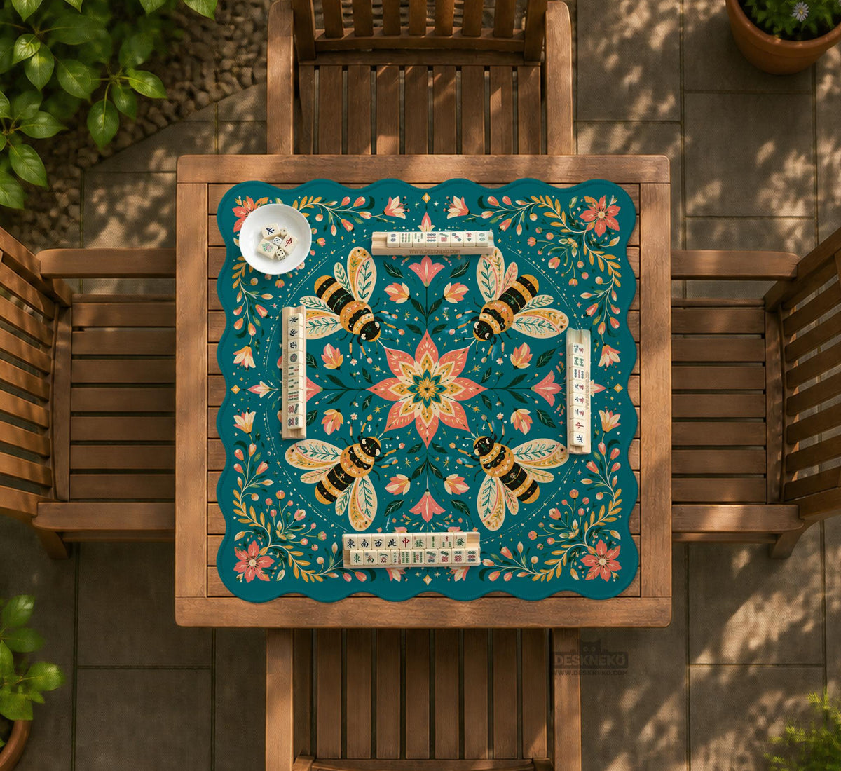 Green mahjong mat with a botanical bee and floral mandala design in teal, coral, cream, and gold.