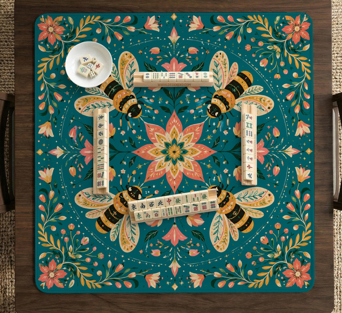 Green mahjong mat with a botanical bee and floral mandala design in teal, coral, cream, and gold.