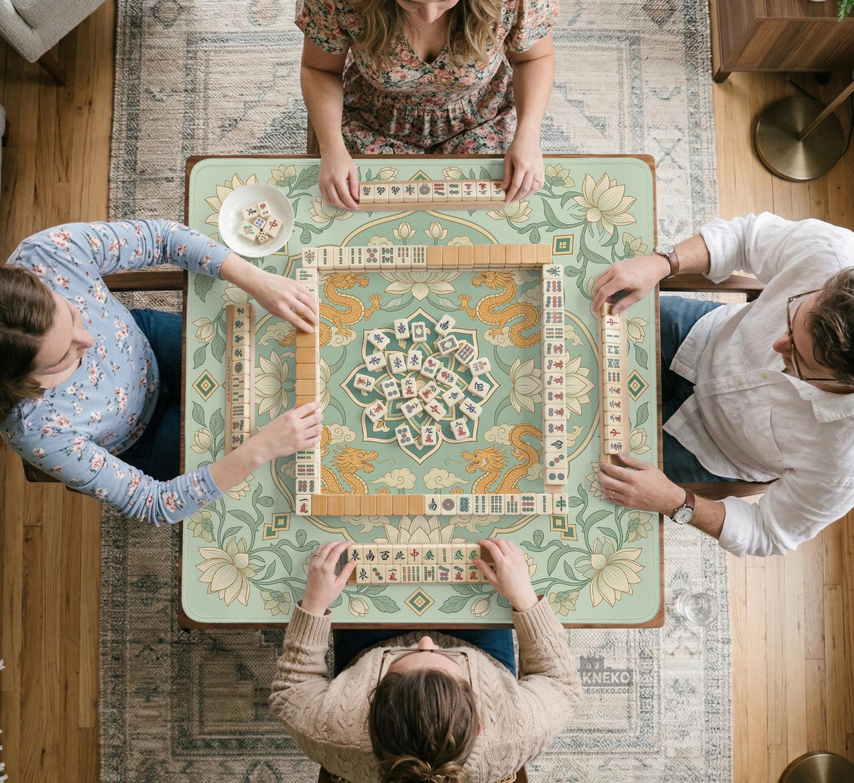 Sage green square mahjong mat with lotus flowers, golden dragons, and an ornamental center design.